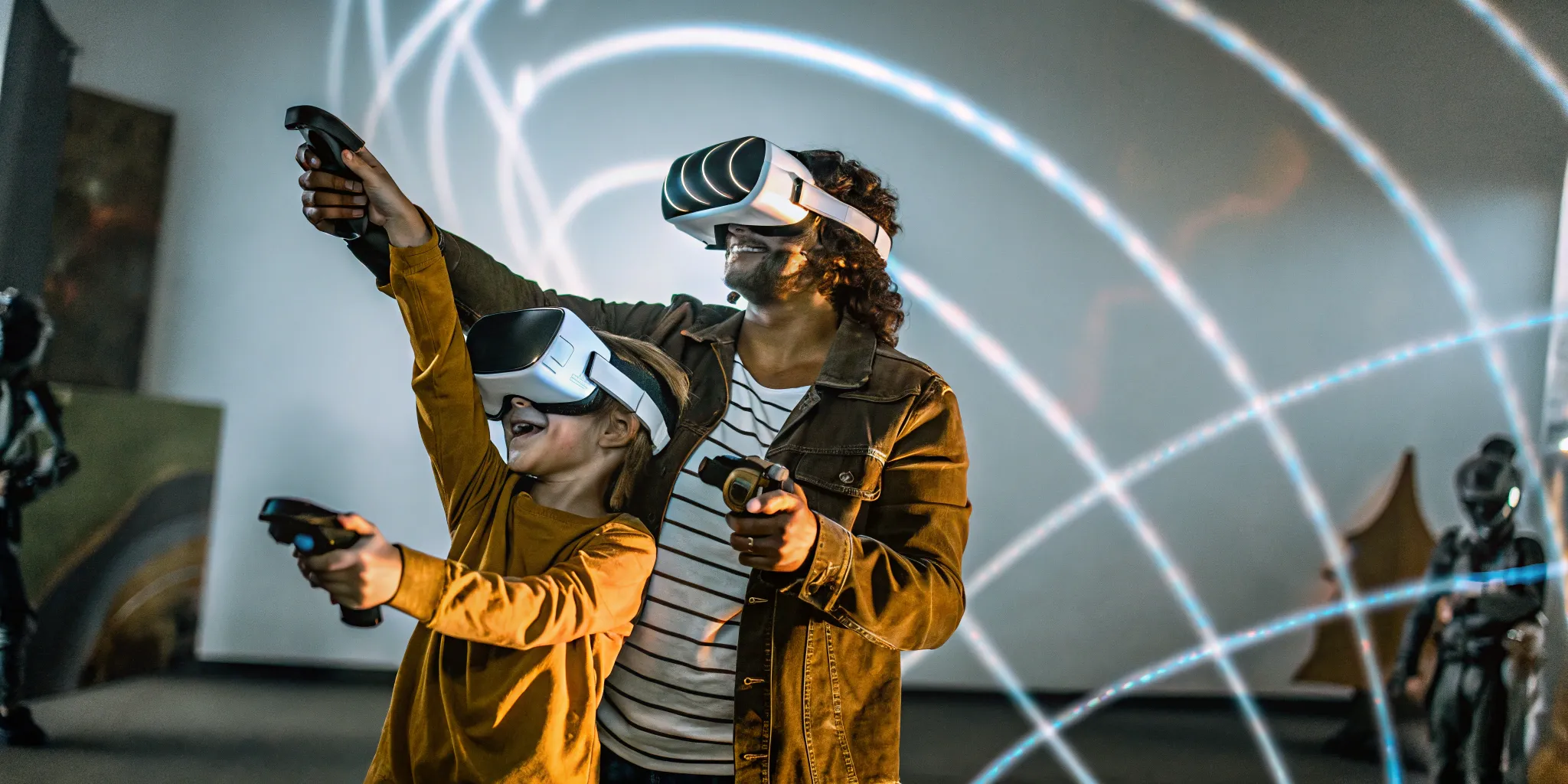 Two people enjoying VR gaming with colorful light effects in background at a birthday party