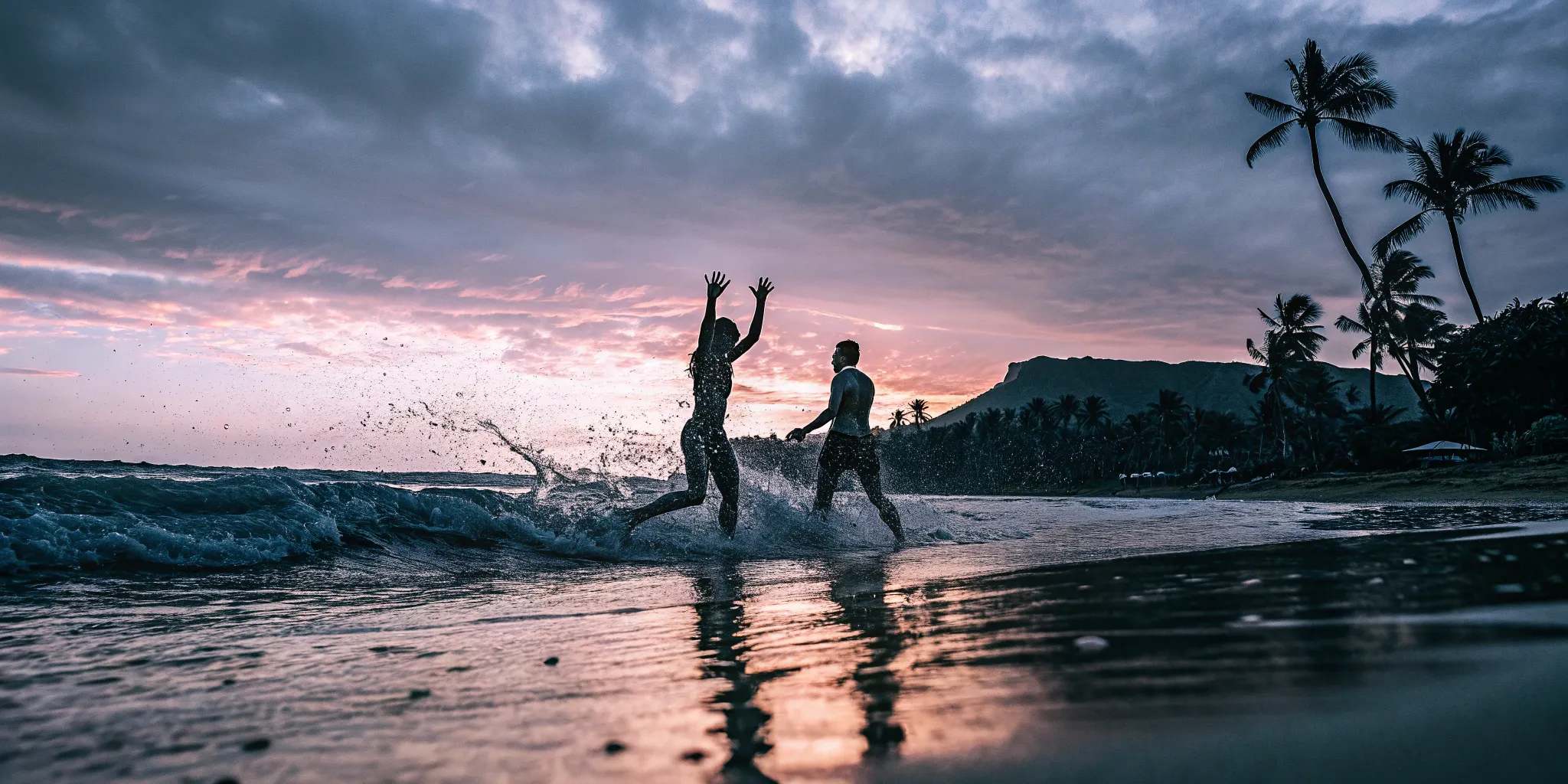 Teens enjoying activities in Oahu, Hawaii at sunset on the beach